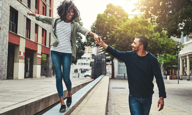 two people walking down the street